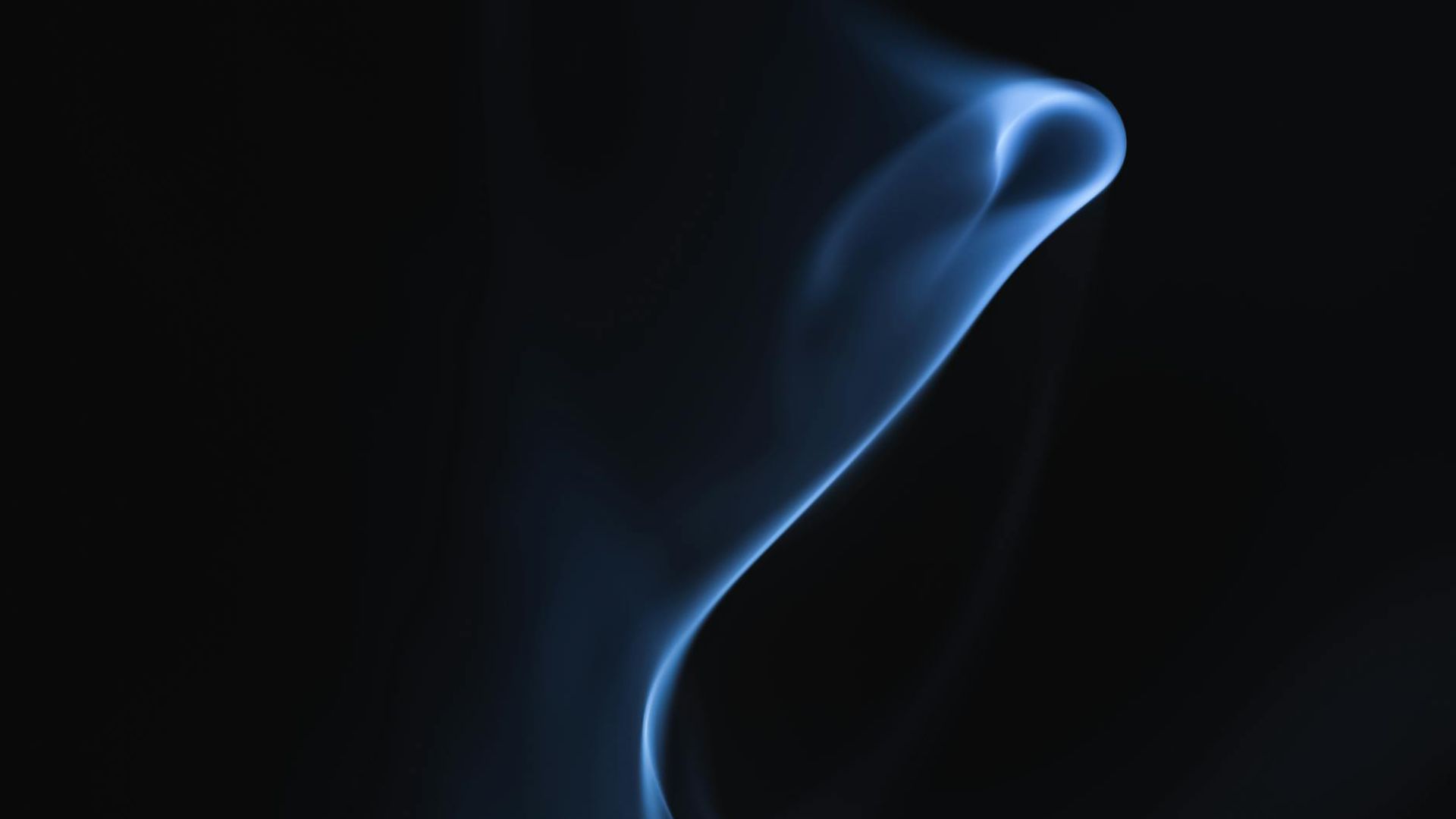 A serene, dark background with subtle aquamarine light patterns suggesting calm movement.